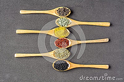 Spices on wooden spoons Stock Photo