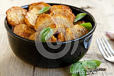 Spicy baked potatoes Stock Photo