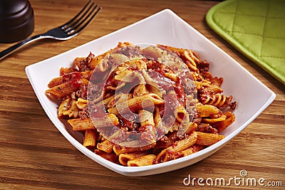 Spicy Beef Chicken Macaroni served in dish isolated on table side view of middle east food Stock Photo