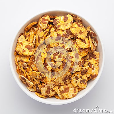 Spicy Chana Jor Garam on a white Ceramic bowl, made with air-fried Bengal Chickpea. Pile of Indian spicy snacks Namkeen, Stock Photo