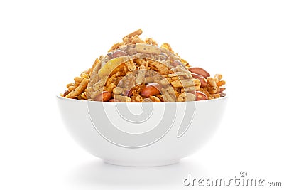 Spicy Chatpata Mixture in a white Ceramic bowl made with peanuts. Stock Photo