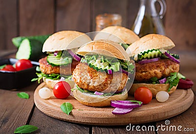 Spicy chicken burgers with tomato and eggplant - sandwich. Stock Photo