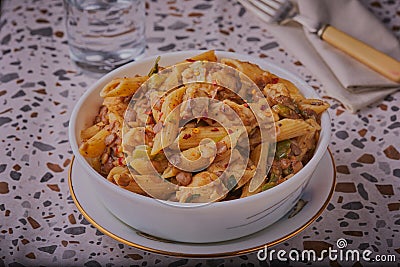 Spicy chicken and pasta with lentils. Stock Photo