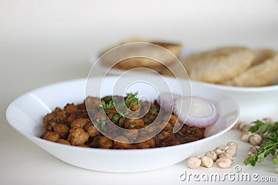 Spicy chickpea gravy with fried Indian flat bread. Locally known as Chole puri Stock Photo