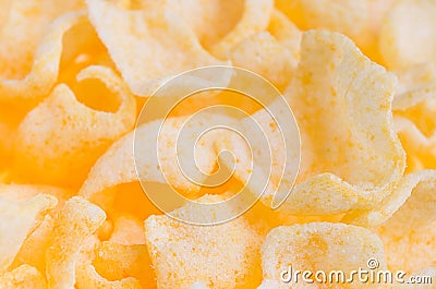 Spicy chips flakes closeup with blur background, texture. Stock Photo