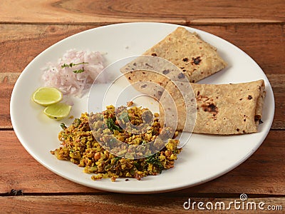 Spicy Egg bhurji or anda bhurji with Chapati, Scrambled egg with Indian flat bread, Protein rich breakfast food. served over a Stock Photo