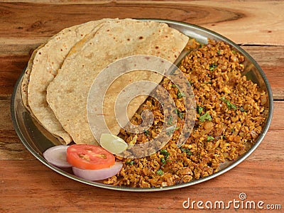 Spicy Egg bhurji or anda bhurji with Chapati, Scrambled egg with Indian flat bread, Protein rich breakfast food. served over a Stock Photo