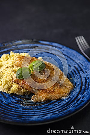 spicy fillet of white cod with couscous Stock Photo