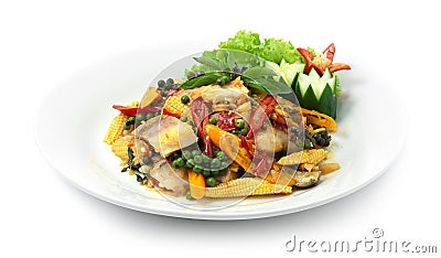 Spicy Fish Stir fried with Chili,Peppers,herbs,eggplants and baby corn Thai Food Style or Cleanfood and Dietfood Stock Photo