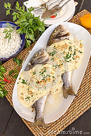 Spicy fish with tahini sauce Stock Photo