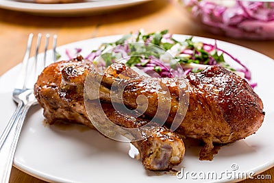 Spicy Glazed Roasted Chicken Drums with Salad Stock Photo