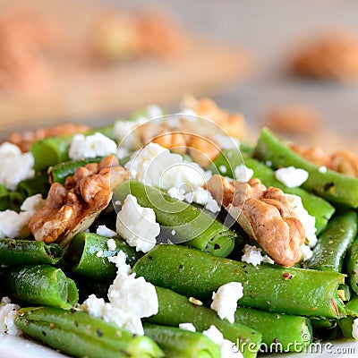 Spicy green beans salad with cottage cheese and walnuts. Summer green beans recipe. Closeup Stock Photo