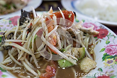 Spicy Green Papaya Salad Thai Cuisine, Som Tum, close up Stock Photo