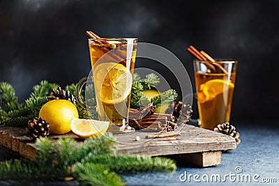 Spicy grog cocktail. Christmas or New Year hot winter drink. Autumn and winter cocktail - grog, hot sangria, mulled wine with tea, Stock Photo