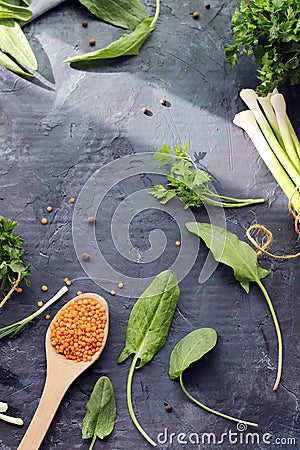 Spicy herbs, asparagus, lemons, seasonings, lentils on the kitchen table Stock Photo