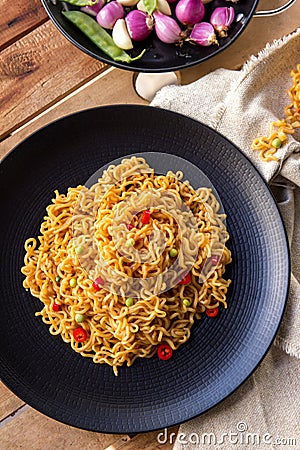 Spicy indonesian fried noodle ready to eat Stock Photo