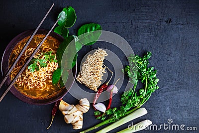 Spicy instant noodles soup And vegetables on a black background Stock Photo