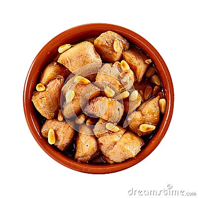 Spicy marinated chicken pieces with pine nuts Stock Photo