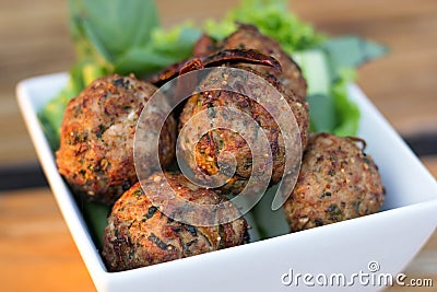 Spicy mince pork balls with salad in a white plate Stock Photo