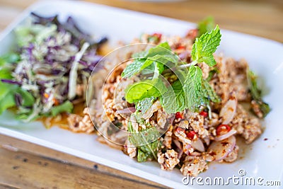Spicy minced pork salad Isaan food Stock Photo