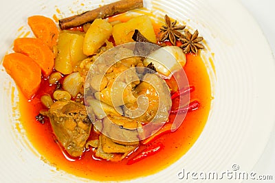 Spicy Muslim chicken curry on white background Stock Photo