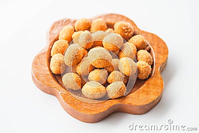 Spicy peanut snack in wood dish Stock Photo