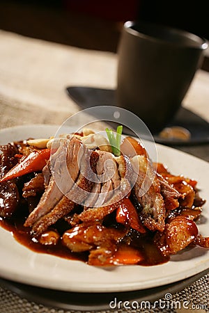 Spicy pork roast with peanuts Stock Photo