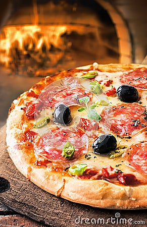 Spicy salami pizza Stock Photo