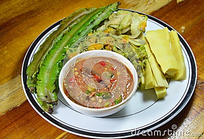 Spicy shrimp paste sauce eat with mixed boiled vegetable on plate Stock Photo