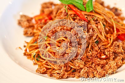 Spicy spaghetti with crispy pork Stock Photo