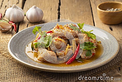 Spicy stir fry clown featherback fishball in a plate Stock Photo