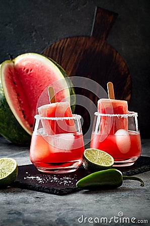 Spicy watermelon popsicle margarita cocktail with jalapeno and lime. Mexican alcoholic drink for Cinco de mayo party. Stock Photo