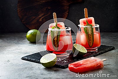 Spicy watermelon popsicle margarita cocktail with jalapeno and lime. Mexican alcoholic drink for Cinco de mayo party. Stock Photo