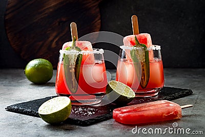 Spicy watermelon popsicle margarita cocktail with jalapeno and lime. Mexican alcoholic drink for Cinco de mayo party. Stock Photo