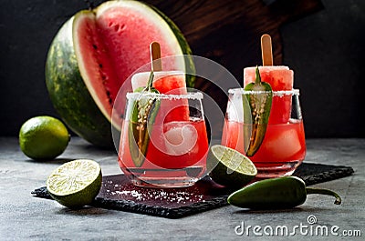 Spicy watermelon popsicle margarita cocktail with jalapeno and lime. Mexican alcoholic drink for Cinco de mayo party. Stock Photo