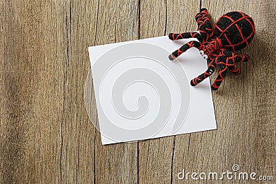 spider doll on old wooden background and have note paper copy sp Stock Photo