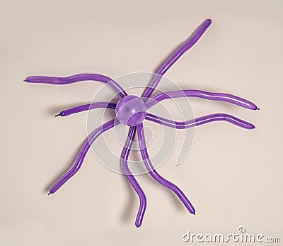 Spider figure made of modelling balloon on color background Stock Photo