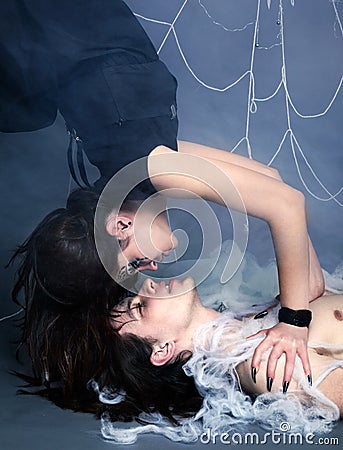 Spider girl and victim Stock Photo