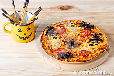 Pizza with spiders and ghosts for halloween on the table, food for halloween Stock Photo