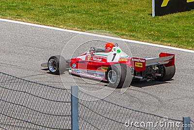 Spielberg, Austria, 2014 -Nikki Lauda on the Honorary Circuit in Formula One race driving his 1977 historic bolid Editorial Stock Photo