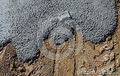 Spilled concrete on the construction site solidified and lock paving was thrown inside. The landscape is generally concreted in a Stock Photo