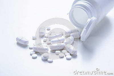 Spilled Pill Bottle isolated.Top view,.pharmacology concept. white pills Stock Photo