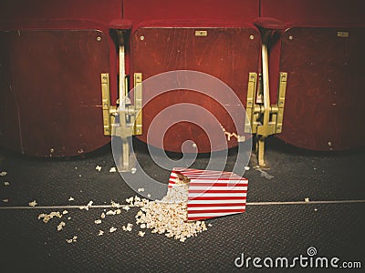 Spilled popcorn on floor in cinema Stock Photo