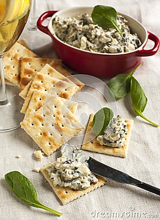 Spinach dip and crackers Stock Photo