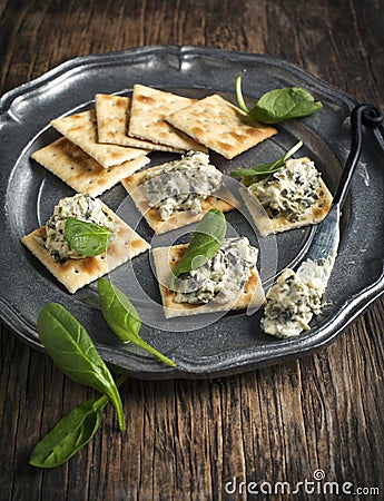 Spinach dip and crackers Stock Photo