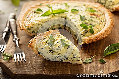 Spinach and herb Florentine quiche Stock Photo