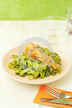 Spinach pasta with shrimp Stock Photo