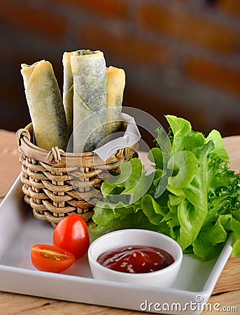 Spinach Rolls on wooden background Stock Photo