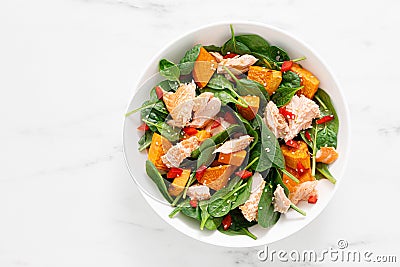 Spinach, salmon and sweetpotato festive thansgiving salad with paprika, top view Stock Photo