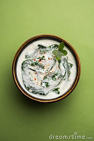 Spinach Yogurt Salad or Palak Raita served in a bowl Stock Photo